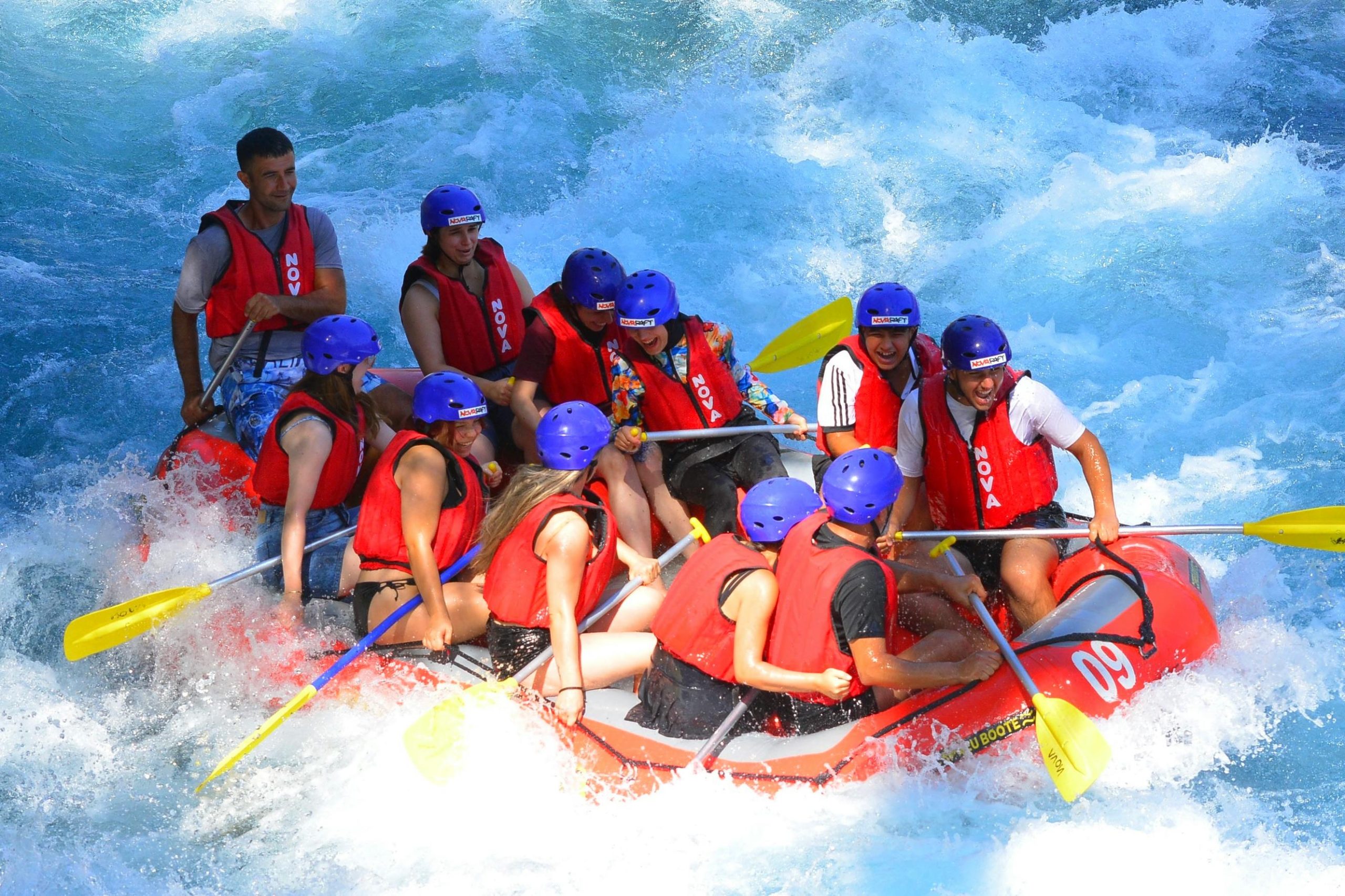 Experience thrilling rafting in Antalya's vibrant blue waters with this adventurous group.