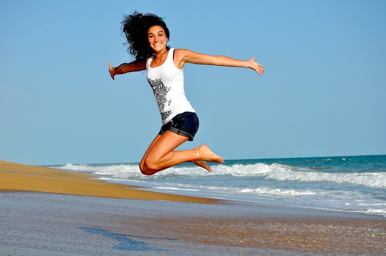 woman, beach, jump, happy woman, female, happy, smiling, smile, waves, sand, sea, ocean, ocean waves, brunette, brunette woman, jumping girl, nature, shore, seashore