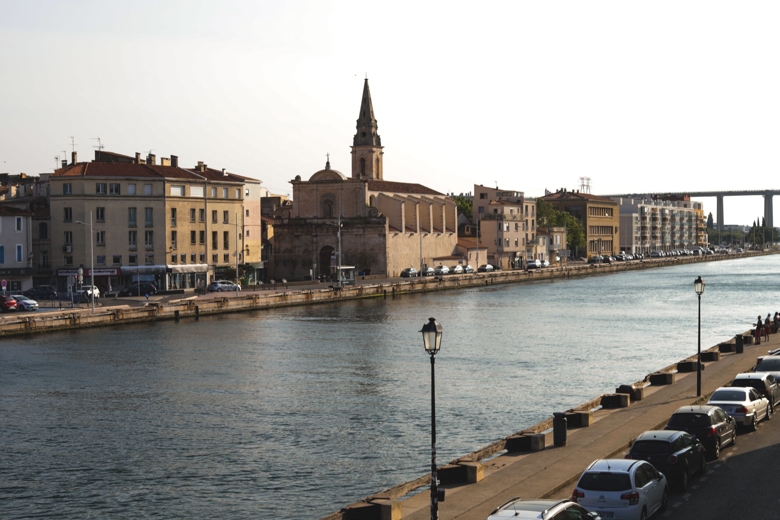 Scenic riverbank in Martigues, France, featuring historic architecture and a serene canal.